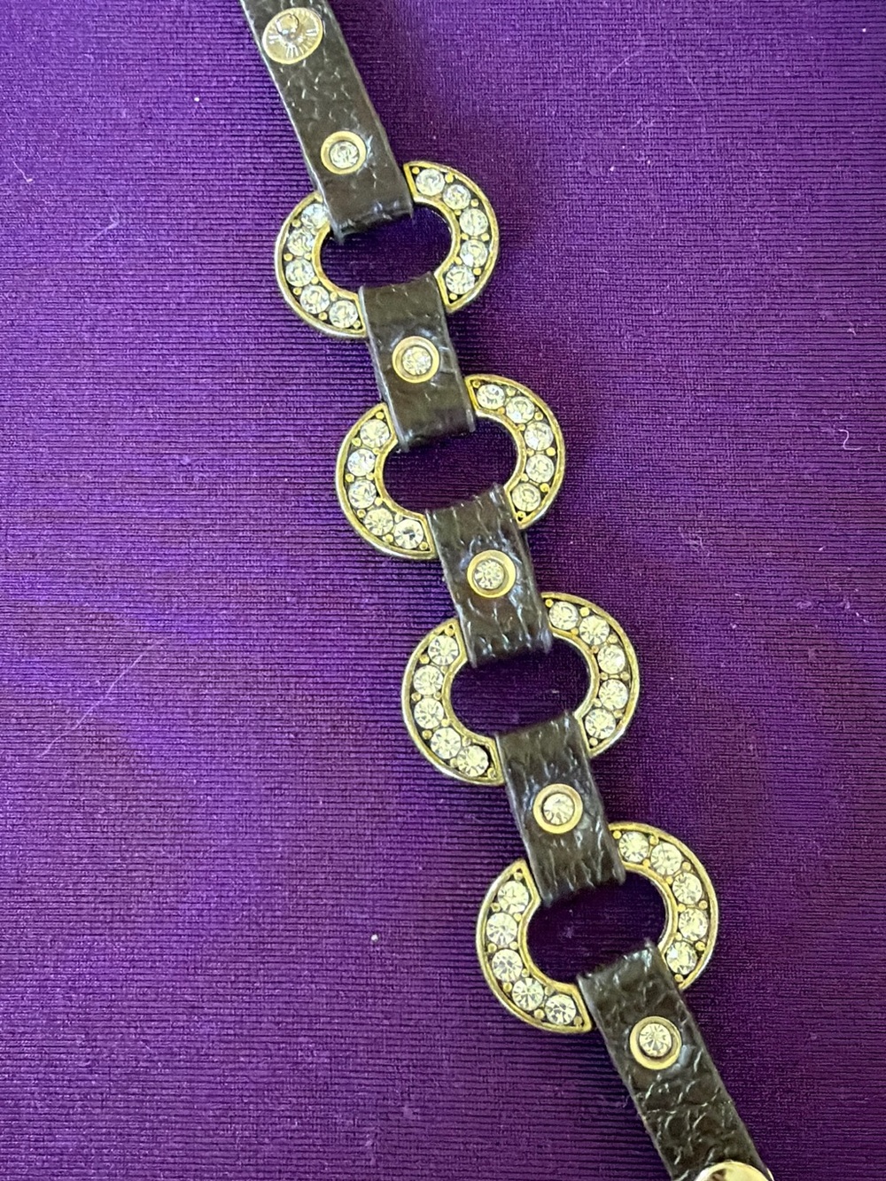 Rhinestone link bracelet in antique gold tone